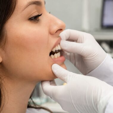 Orthodontist Evaluating An Overbite Before Braces Treatment